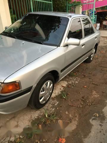 Mazda 323   1995 - Bán xe cũ Mazda 323 đời 1995, màu bạc xe gia đình