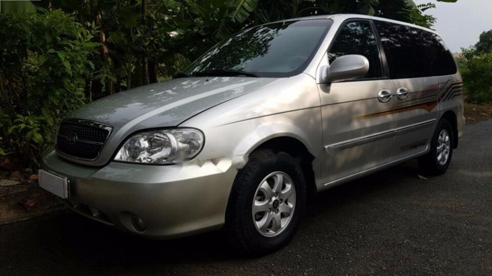 Kia Carnival GS 2006 - Cần bán gấp Kia Carnival GS đời 2006, màu bạc số sàn