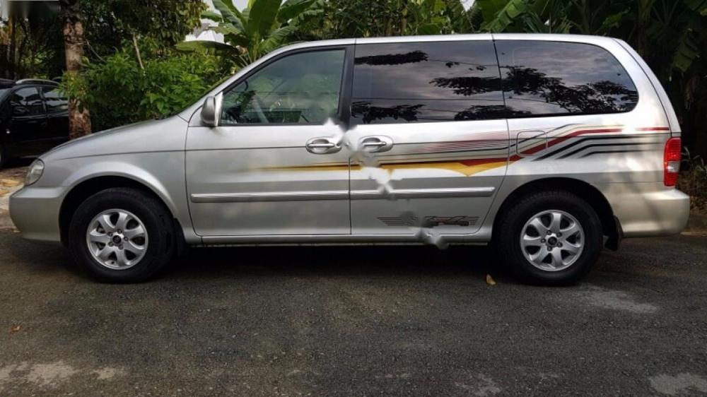 Kia Carnival GS 2006 - Cần bán gấp Kia Carnival GS đời 2006, màu bạc số sàn