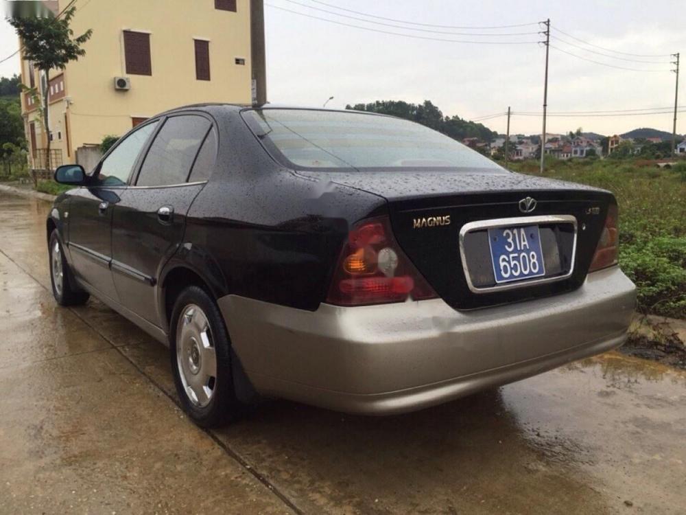 Daewoo Magnus 2004 - Bán Daewoo Magnus đời 2004, màu đen số tự động, 210 triệu