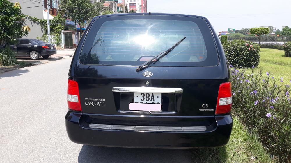 Kia Carnival 2007 - Cần bán Kia Carnival đăng ký 2007, màu đen còn mới, giá tốt 235tr