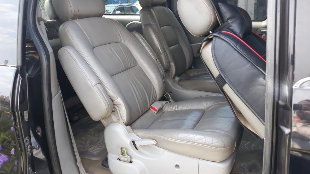 Kia Carnival 2007 - Cần bán Kia Carnival đăng ký 2007, màu đen còn mới, giá tốt 235tr