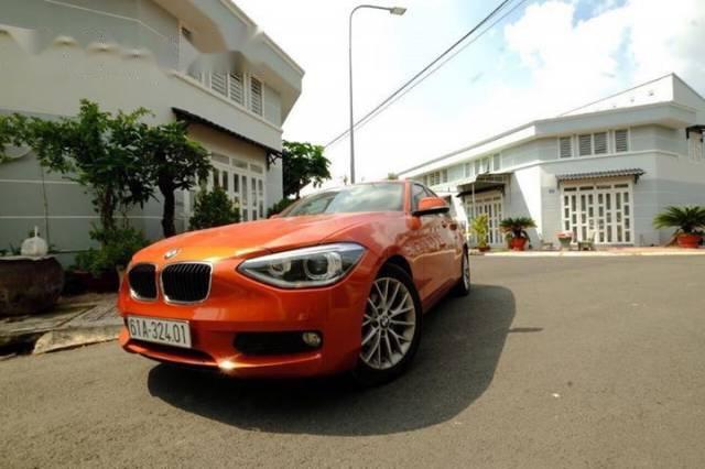 BMW 1 Series  116i  2014 - Chính chủ bán BMW 1 Series 116i đời 2014, màu cam