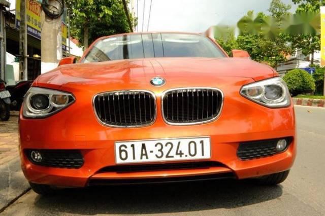 BMW 1 Series  116i  2014 - Chính chủ bán BMW 1 Series 116i đời 2014, màu cam