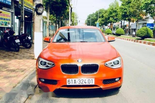 BMW 1 Series  116i  2014 - Chính chủ bán BMW 1 Series 116i đời 2014, màu cam