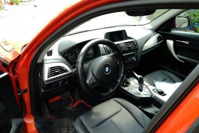 BMW 1 Series  116i  2014 - Chính chủ bán BMW 1 Series 116i đời 2014, màu cam