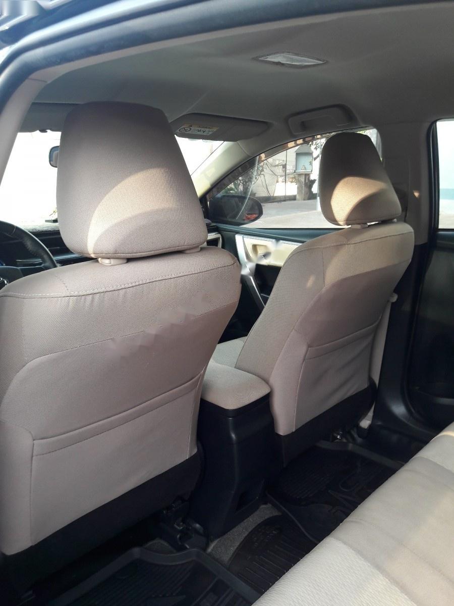 Toyota Corolla altis 1.8G MT 2014 - Bán Toyota Corolla altis 1.8G MT đời 2014, màu đen xe gia đình