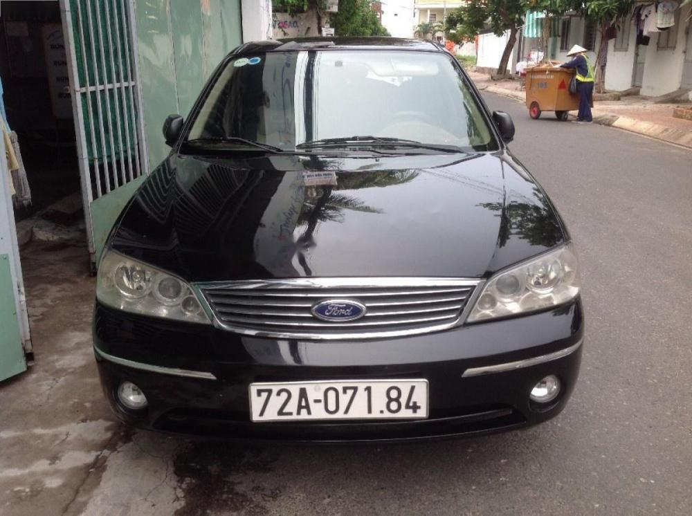 Ford Laser Ghia 1.8  2004 - Bán Ford Laser Ghia 1.8 năm 2004, màu đen số sàn