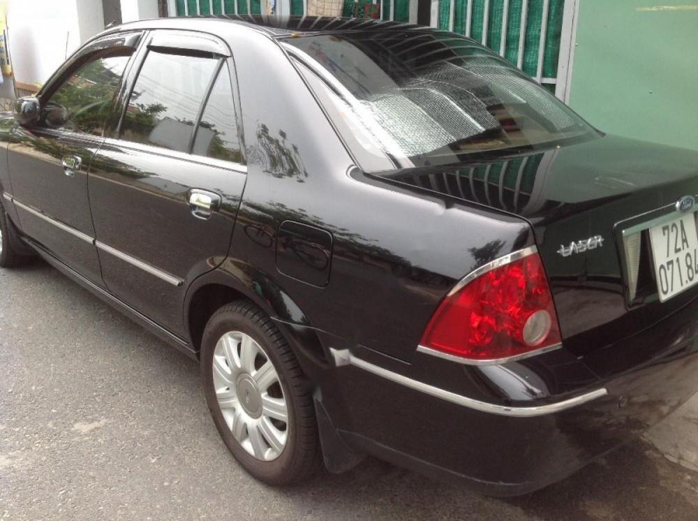 Ford Laser Ghia 1.8  2004 - Bán Ford Laser Ghia 1.8 năm 2004, màu đen số sàn