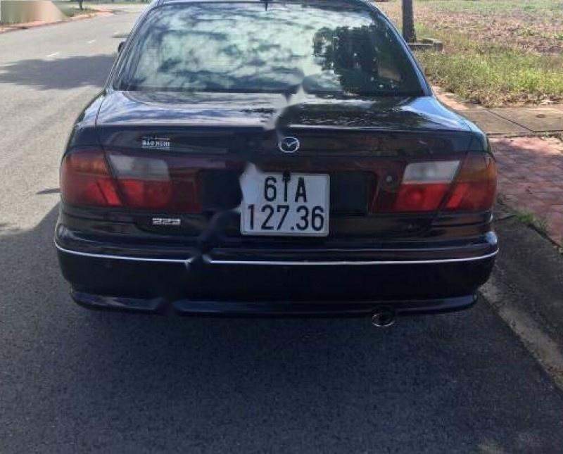 Mazda 323 1999 - Bán xe Mazda 323 đời 1999, màu đen, nhập khẩu