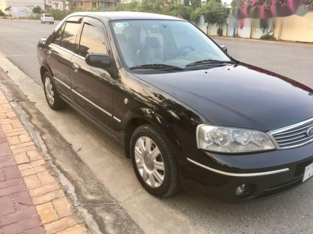 Ford Laser 1.8 MT Ghia  2004 - Cần bán Ford Laser 1.8 MT Ghia đời 2004, màu đen xe gia đình