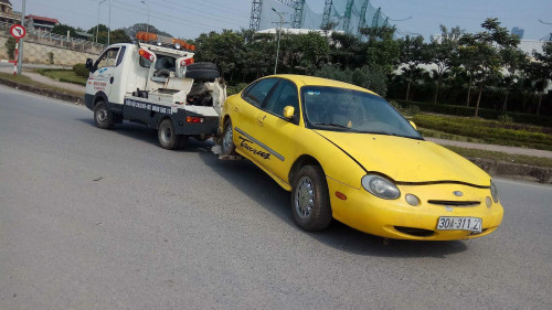 Ford Taurus   AT  1997 - Cần bán lại xe Ford Taurus AT đời 1997, màu vàng, 150tr