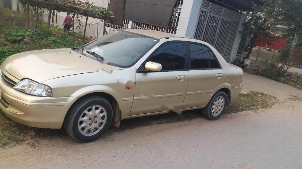 Ford Laser Delu 2001 - Cần bán xe Ford Laser Delu năm 2001, màu vàng