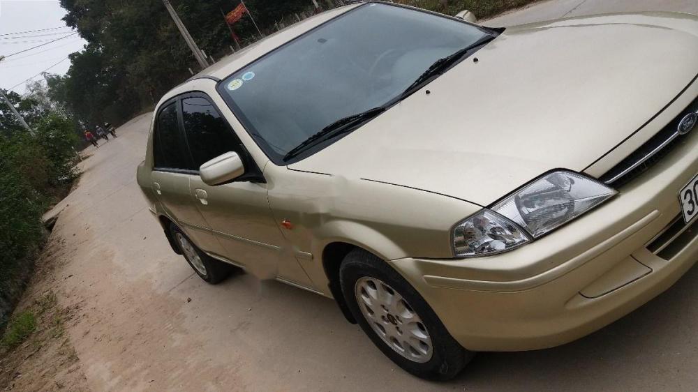 Ford Laser Delu 2001 - Cần bán xe Ford Laser Delu năm 2001, màu vàng