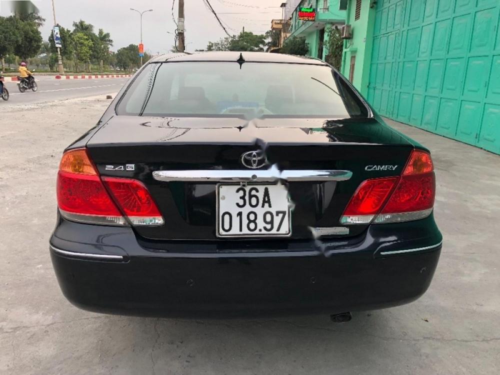 Toyota Camry 2.4G 2004 - Bán Toyota Camry 2.4G sản xuất năm 2004, màu đen