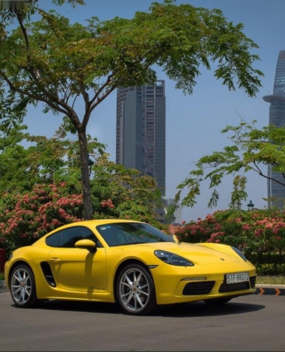 Porsche Cayman 718 2017 - Cần bán lại xe Porsche Cayman 718 2017, màu vàng, nhập khẩu nguyên chiếc như mới