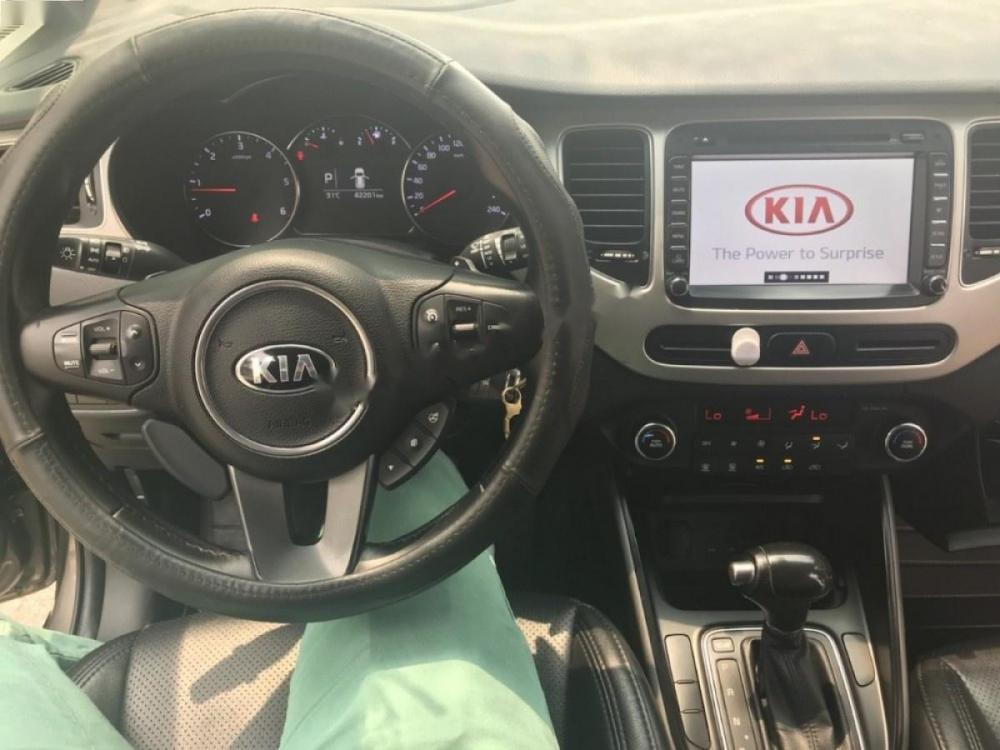 Kia Rondo 2015 - Bán ô tô Kia Rondo sản xuất 2015, màu nâu, số tự động, 596 triệu