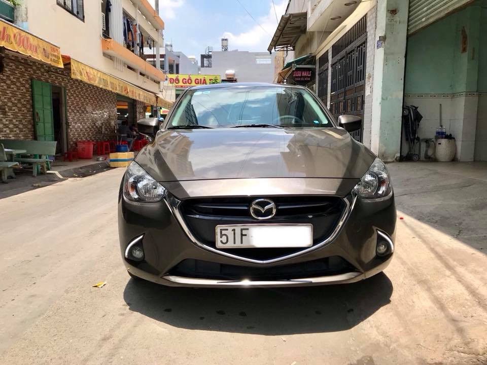 Mazda 2 AT 2016 - Bán Mazda 2 AT sản xuất năm 2016, màu nâu xe gia đình