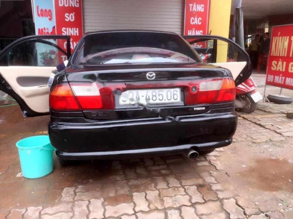 Mazda 323 1997 - Cần bán Mazda 323 1997, màu đen, nhập khẩu, 85tr