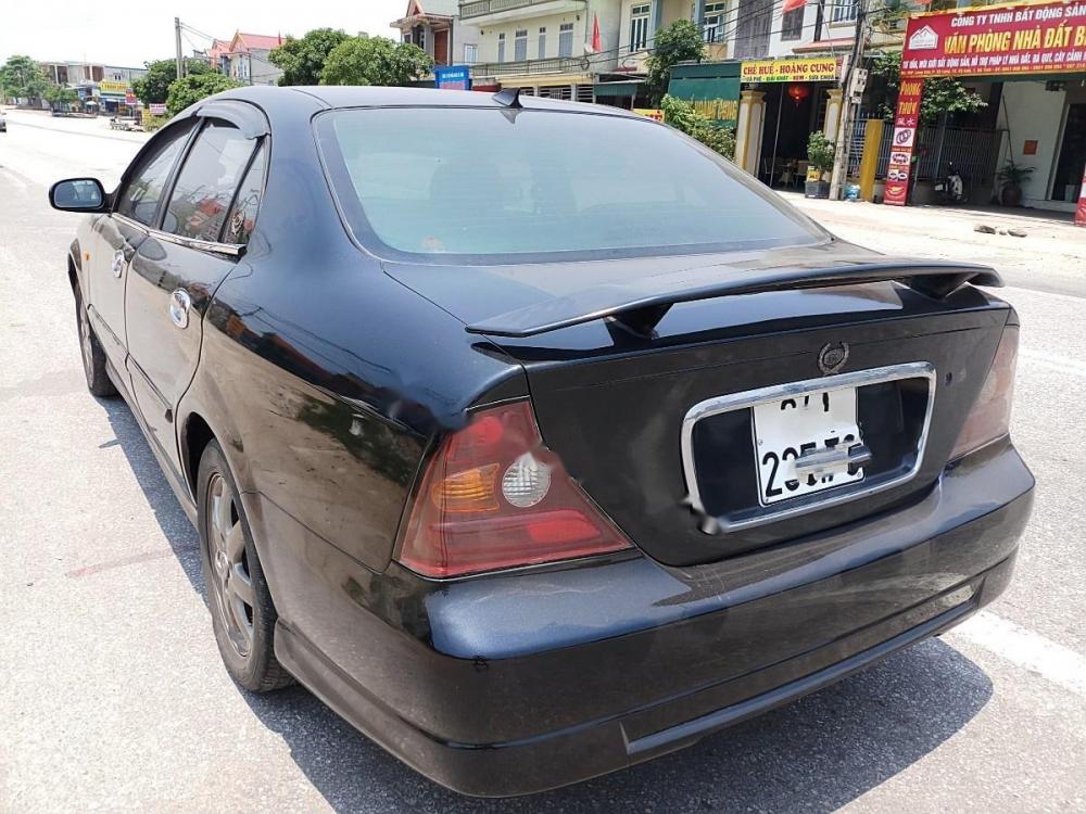 Daewoo Magnus 2.0 MT 2004 - Chính chủ bán Daewoo Magnus 2.0 MT 2004, màu đen