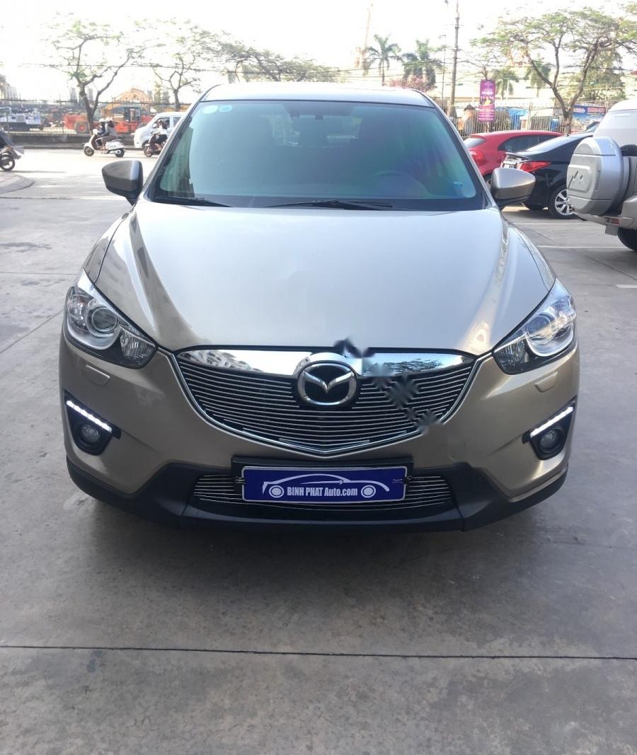 Mazda CX 5 2.0 AT AWD 2015 - Cần bán lại xe Mazda CX 5 2.0 AT AWD năm sản xuất 2015, màu ghi vàng