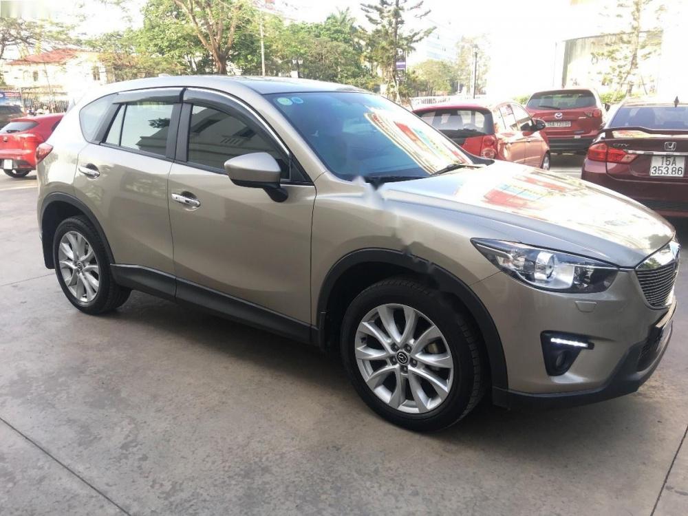 Mazda CX 5 2.0 AT AWD 2015 - Cần bán lại xe Mazda CX 5 2.0 AT AWD năm sản xuất 2015, màu ghi vàng