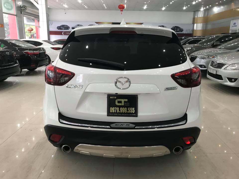 Mazda CX 5 2.0AT 2016 - Cần bán gấp Mazda CX 5 2.0AT sản xuất năm 2016, màu trắng số tự động