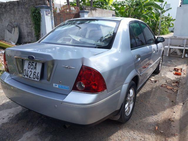 Ford Laser   2004 - Cần bán Ford Laser sản xuất năm 2004, màu bạc xe gia đình, giá 185tr