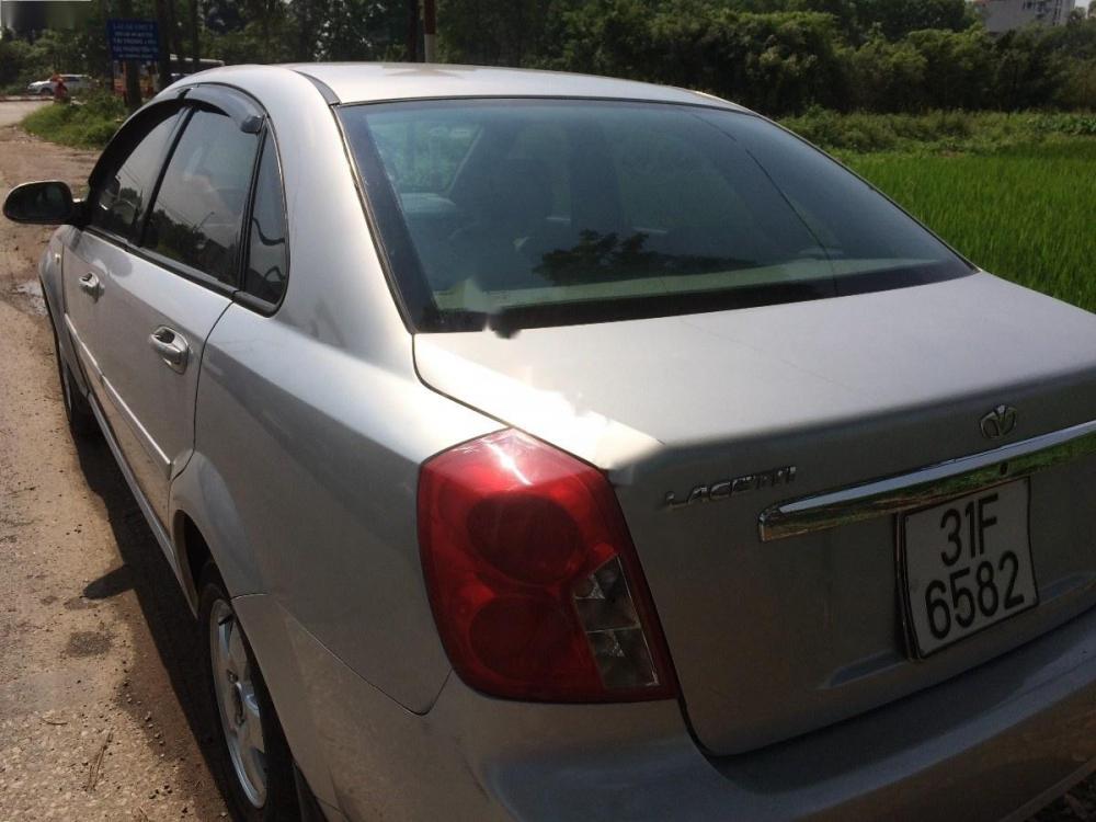 Daewoo Lacetti EX 2010 - Gia đình bán Daewoo Lacetti 1.6 sản xuất năm 2010, màu vàng cát