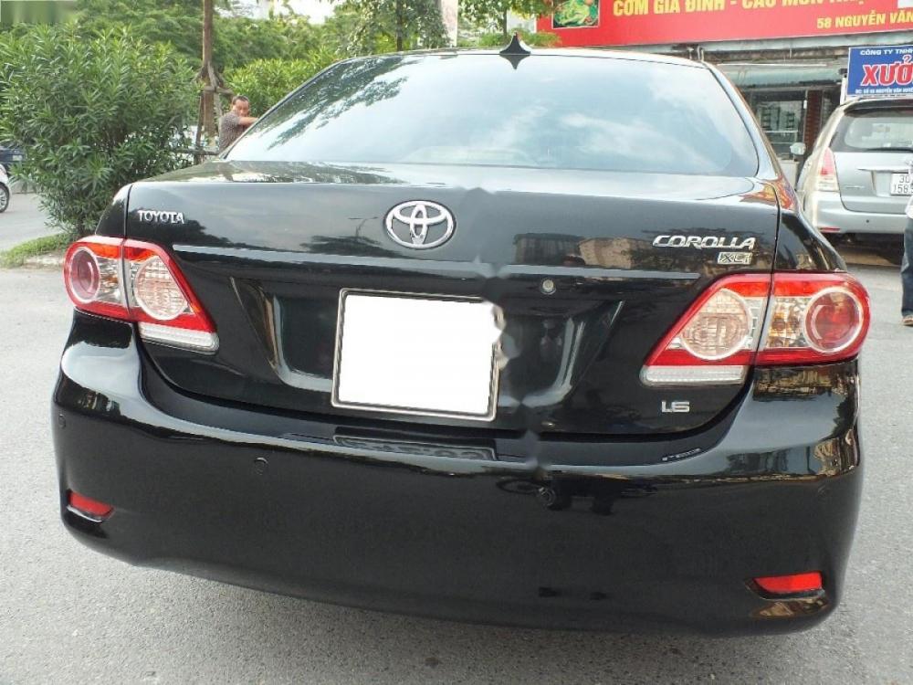 Toyota Corolla XLI 1.6 2011 - Cần bán lại xe Toyota Corolla XLI 1.6 năm 2011, màu đen, nhập khẩu chính chủ, 550tr