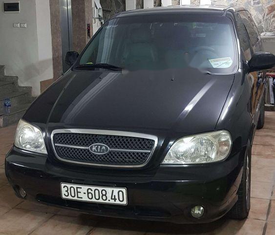 Kia Carnival 2005 - Cần bán Kia Carnival năm sản xuất 2005, màu đen xe gia đình, giá chỉ 340 triệu