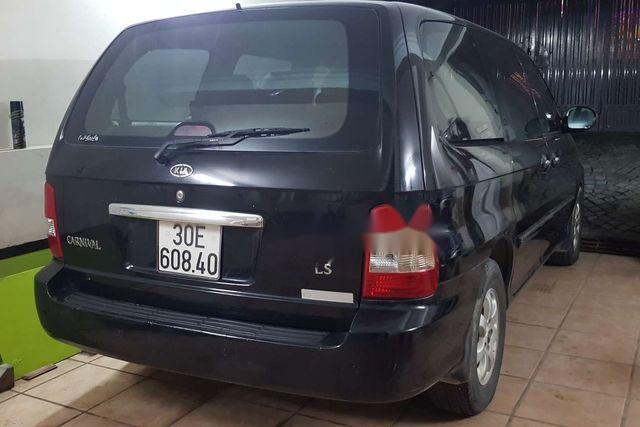 Kia Carnival 2005 - Cần bán Kia Carnival năm sản xuất 2005, màu đen xe gia đình, giá chỉ 340 triệu