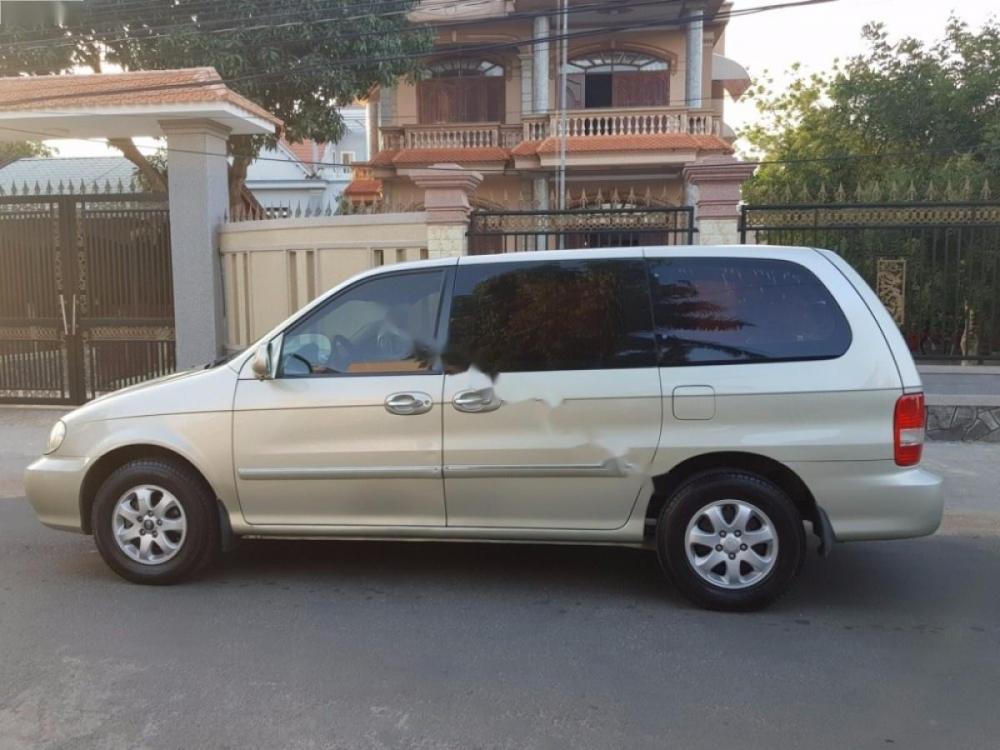 Kia Carnival GS 2.5 AT 2009 - Bán Kia Carnival GS 2.5 AT năm sản xuất 2009, màu vàng cát