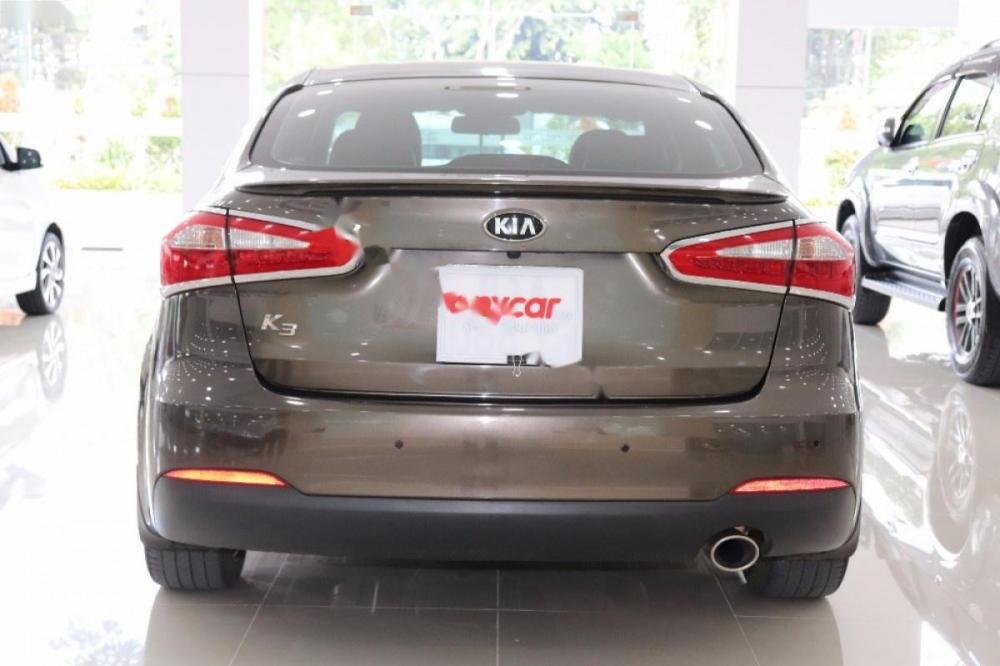 Kia K3 1.6 AT 2014 - Bán Kia K3 1.6 đời 2014, màu nâu số tự động, giá chỉ 520 triệu