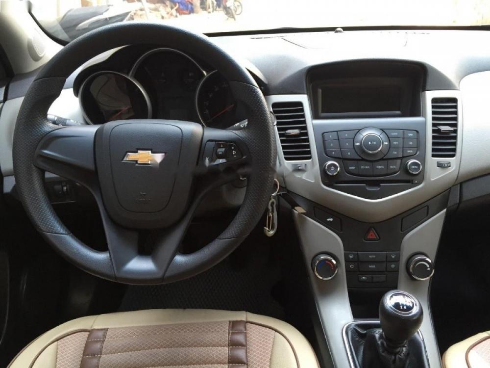 Chevrolet Cruze LT 1.6 MT 2015 - Bán xe Chevrolet Cruze LT 1.6 MT sản xuất năm 2015, màu vàng cát