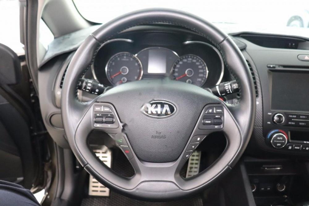 Kia K3 1.6 AT 2014 - Bán Kia K3 1.6 đời 2014, màu nâu số tự động, giá chỉ 520 triệu