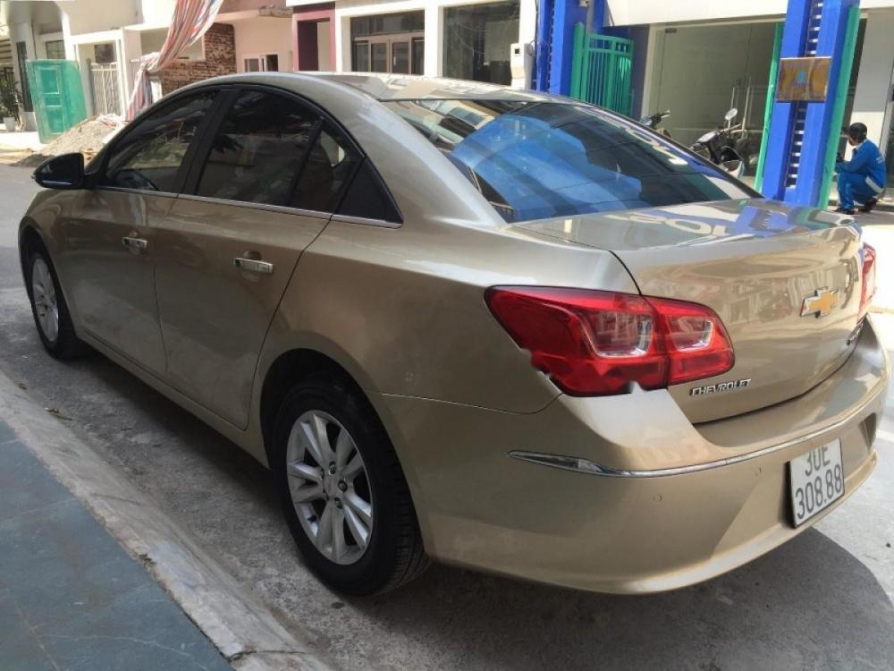 Chevrolet Cruze LT 1.6 MT 2015 - Bán xe Chevrolet Cruze LT 1.6 MT sản xuất năm 2015, màu vàng cát