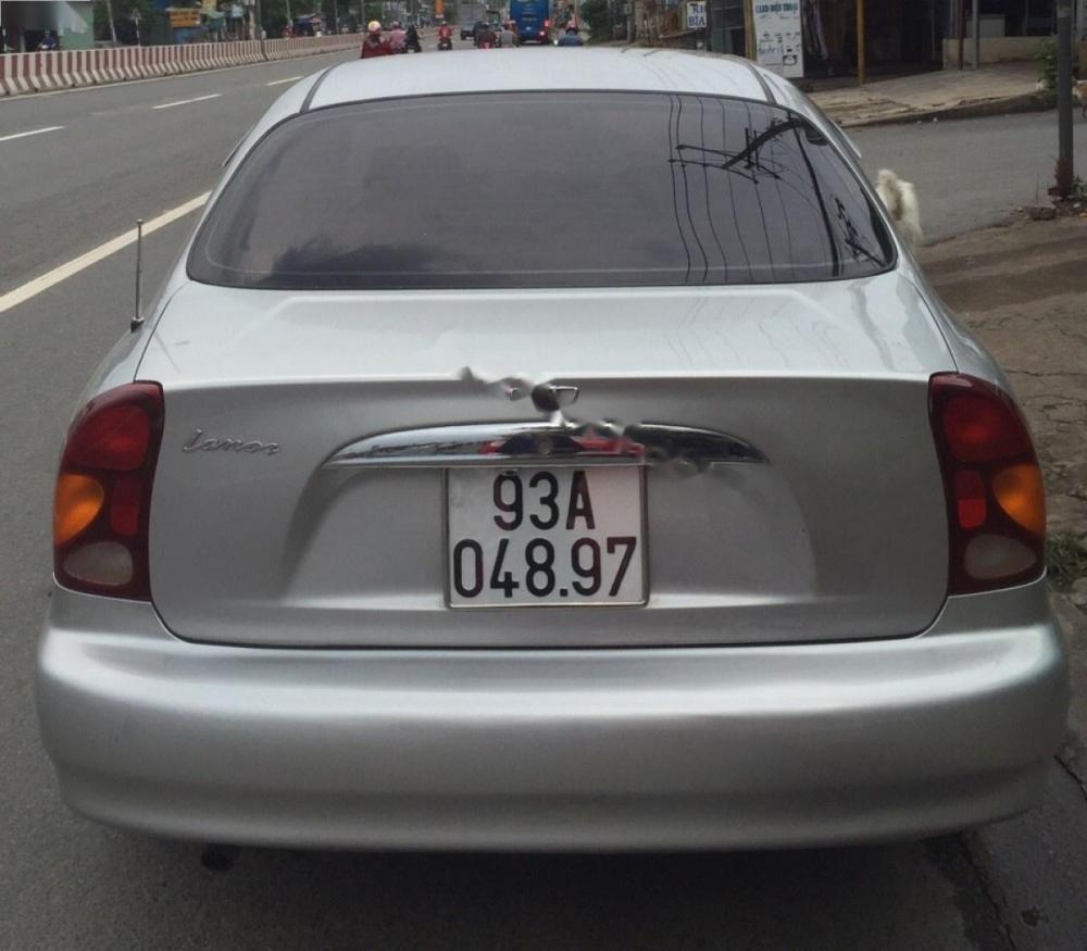 Daewoo Lanos SX 2005 - Cần bán Daewoo Lanos SX năm sản xuất 2005, màu bạc xe gia đình