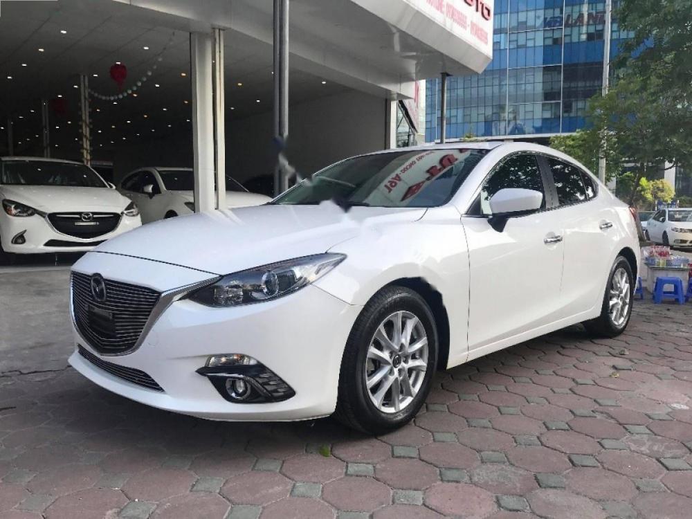 Mazda 3 1.5AT 2015 - Bán xe Mazda 3 1.5AT 2015, màu trắng số tự động, giá 620tr