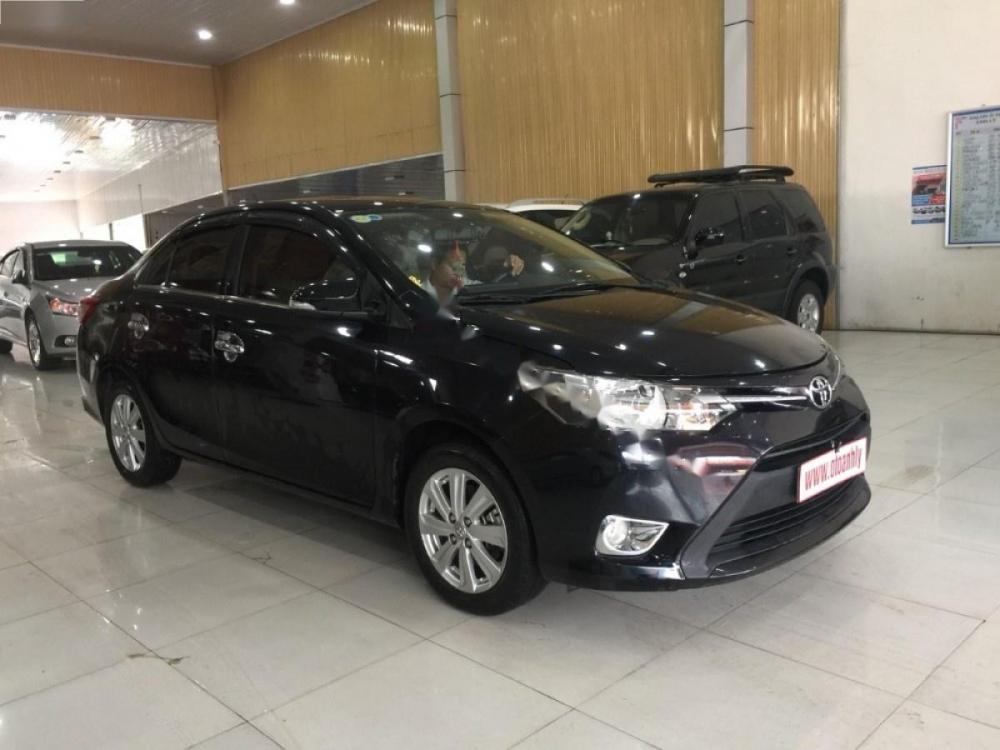 Toyota Vios 1.5E 2015 - Bán ô tô Toyota Vios 1.5E sản xuất 2015, màu đen số sàn