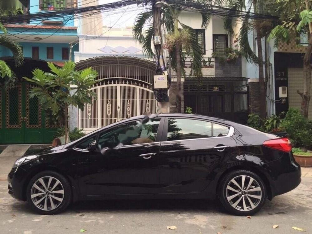 Kia K3 2.0AT 2015 - Chính chủ bán xe Kia K3 2.0AT sản xuất năm 2015, màu đen