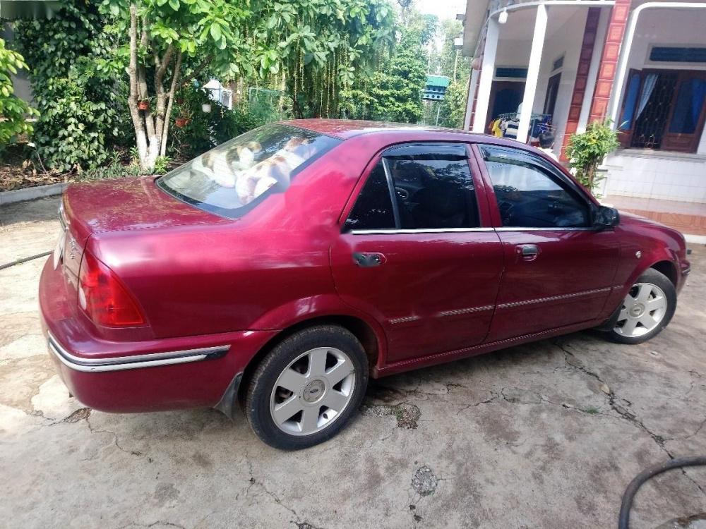 Ford Laser Ghia 1.8 MT 2003 - Chính chủ bán ô tô Ford Laser Ghia 1.8 MT 2003, màu đỏ