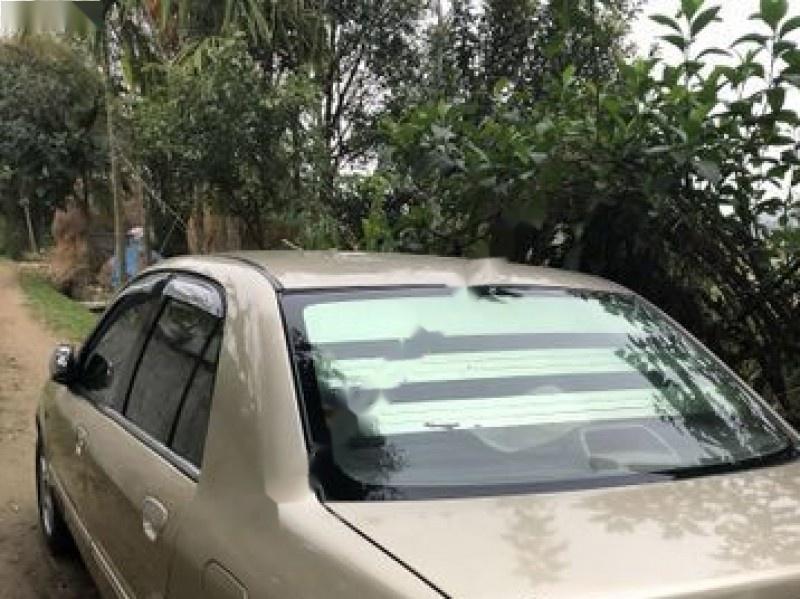 Ford Laser GHIA 1.8 MT 2003 - Bán xe Ford Laser GHIA 1.8 MT sản xuất 2003, màu vàng cát