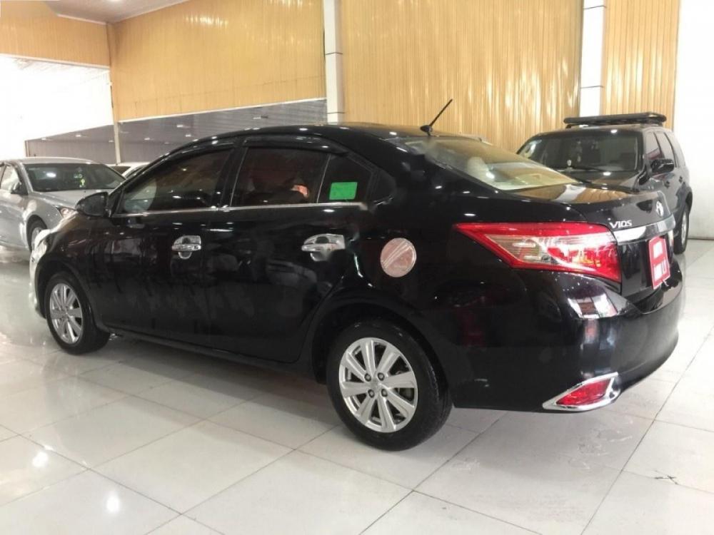 Toyota Vios 1.5E 2015 - Bán ô tô Toyota Vios 1.5E sản xuất 2015, màu đen số sàn