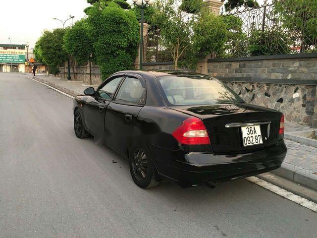 Daewoo Nubira 2001 - Cần bán gấp Daewoo Nubira 2001, màu đen