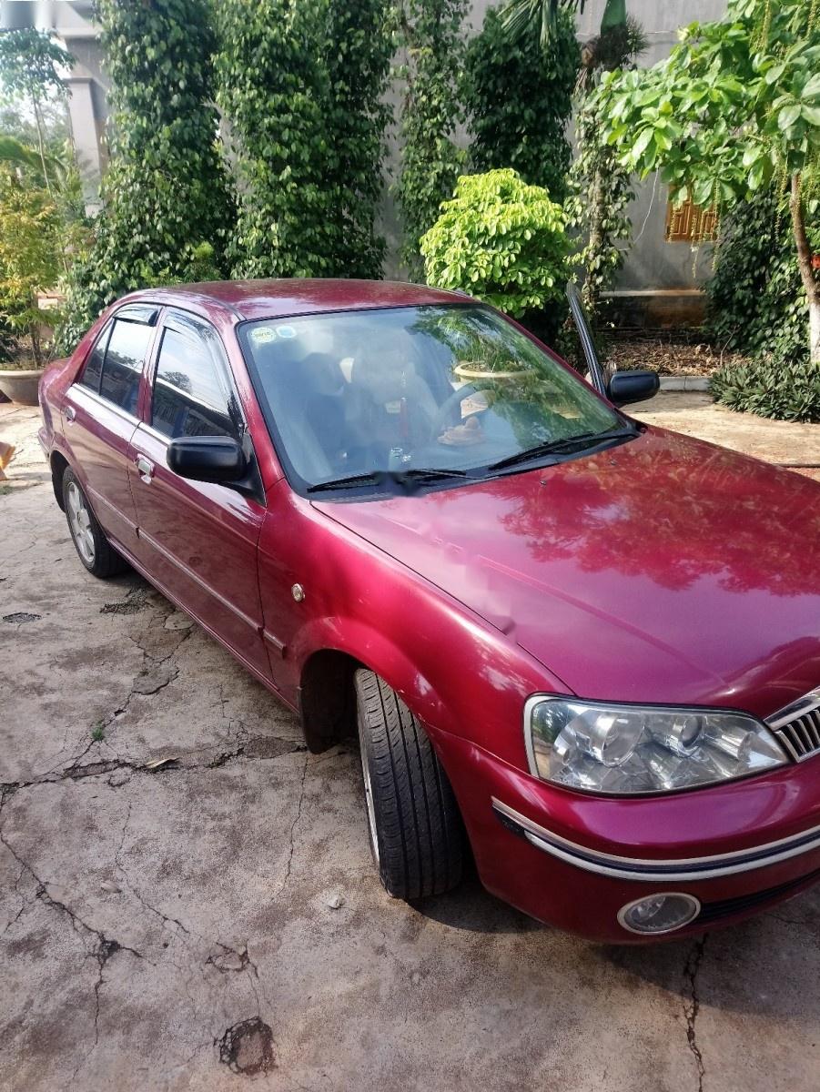 Ford Laser Ghia 1.8 MT 2003 - Chính chủ bán ô tô Ford Laser Ghia 1.8 MT 2003, màu đỏ