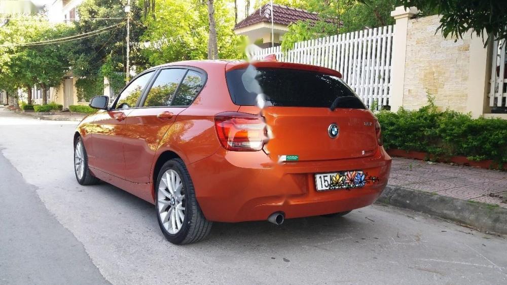 BMW 1 Series 116i  2013 - Bán BMW 1 Series 116i đời 2013, xe nhập, màu cam