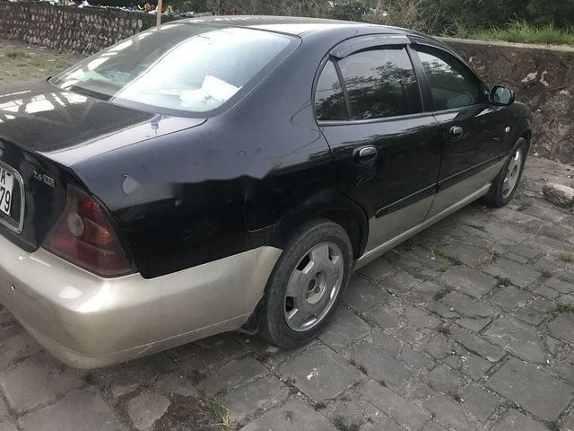 Daewoo Magnus 2004 - Bán Daewoo Magnus năm 2004, màu đen