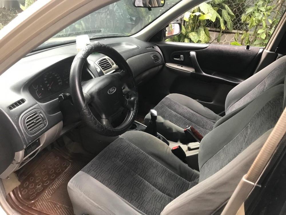 Ford Laser 2002 - Bán xe Ford Laser sản xuất 2002, màu vàng, 200tr