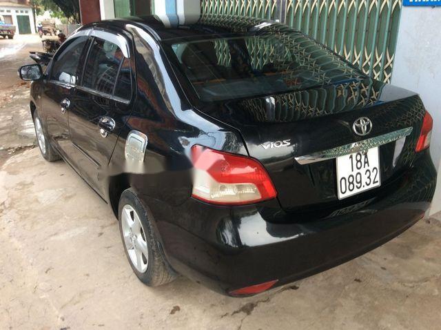 Toyota Vios E 2009 - Cần bán Toyota Vios E sản xuất năm 2009, màu đen còn mới, giá tốt